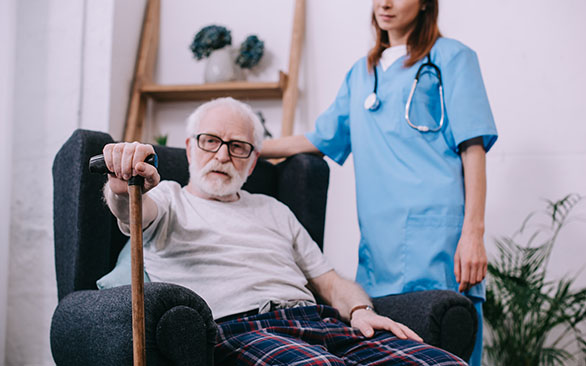 Nurse behind a patient in Hospice Care in Baltimore